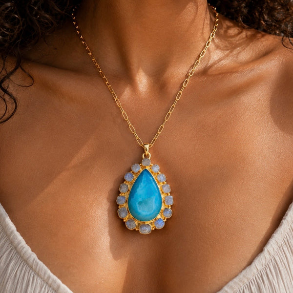 Solar Bloom Blue Agate Druzy pendant surrounded by natural raw Rainbow Moonstones on an 18k gold plated chain