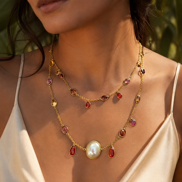 Close-up of natural mixed Tourmalines and an iridescent Pearl set in 18k gold plated silver