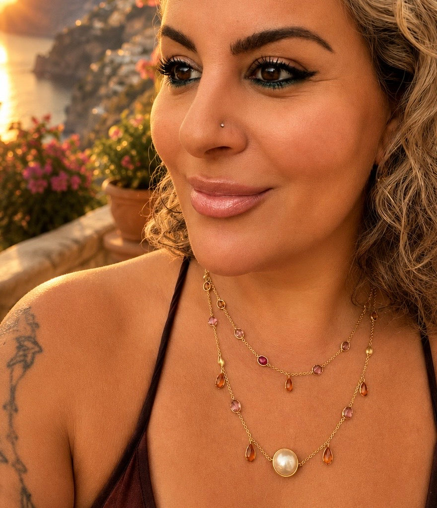 DanAmara Zarif two layer Tourmaline and Pearl necklace displayed on natural stone